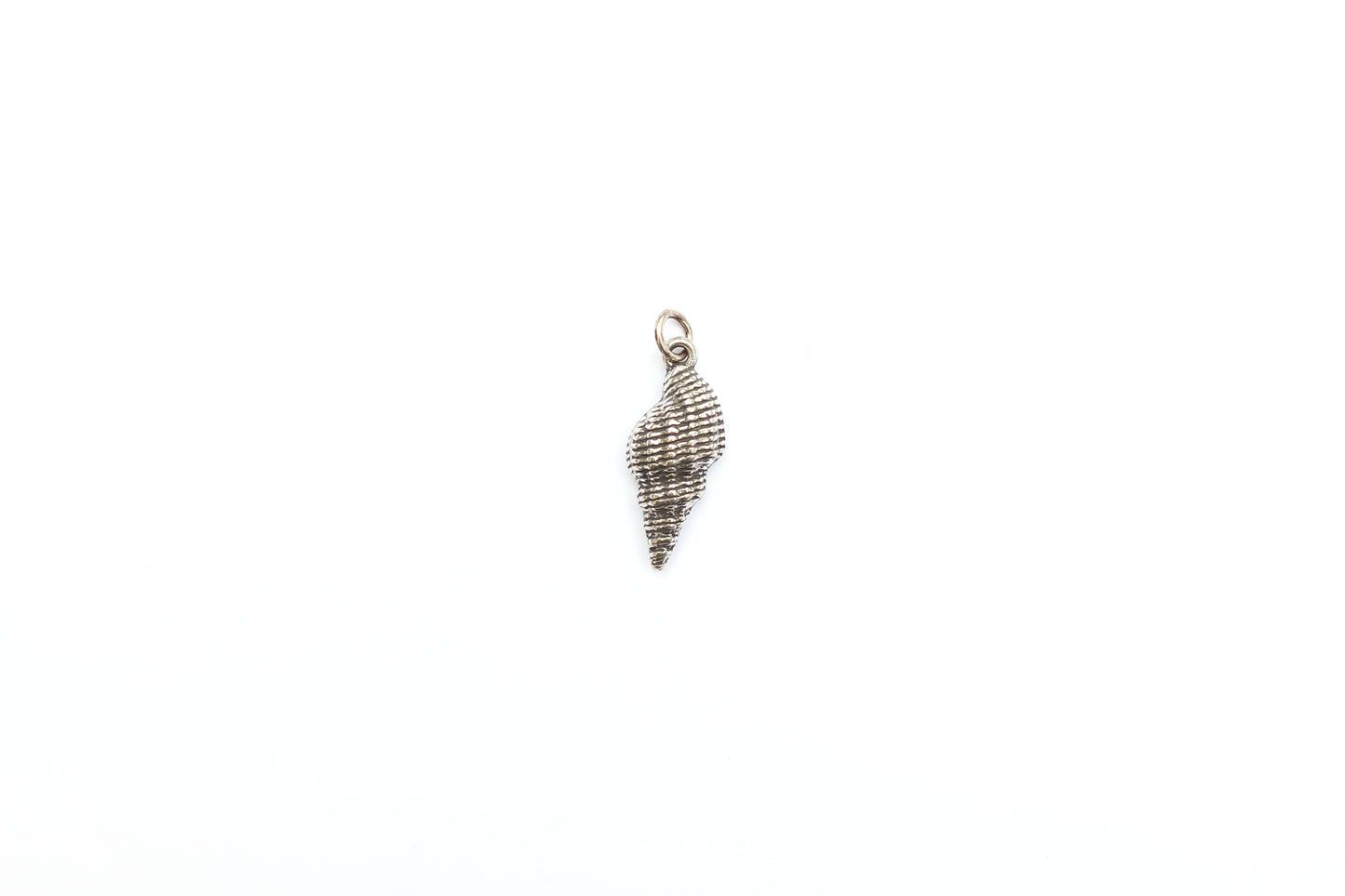 Spiral Shell Charm in Britannium – Oceanic Elegance in Metal Form