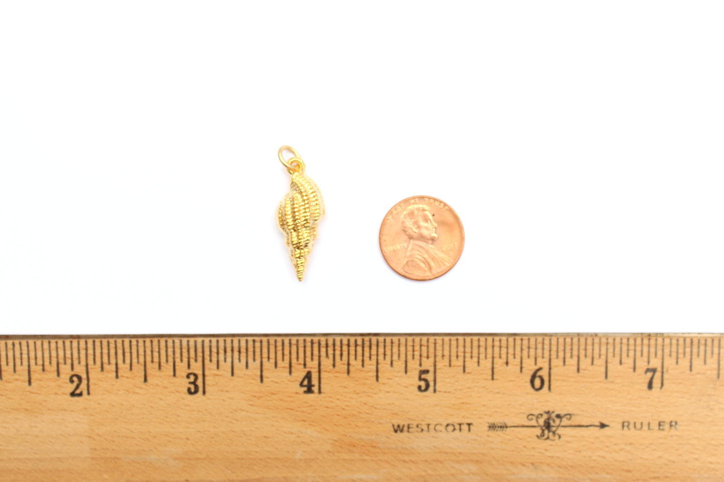 Spiral Shell Charm in Britannium – Oceanic Elegance in Metal Form